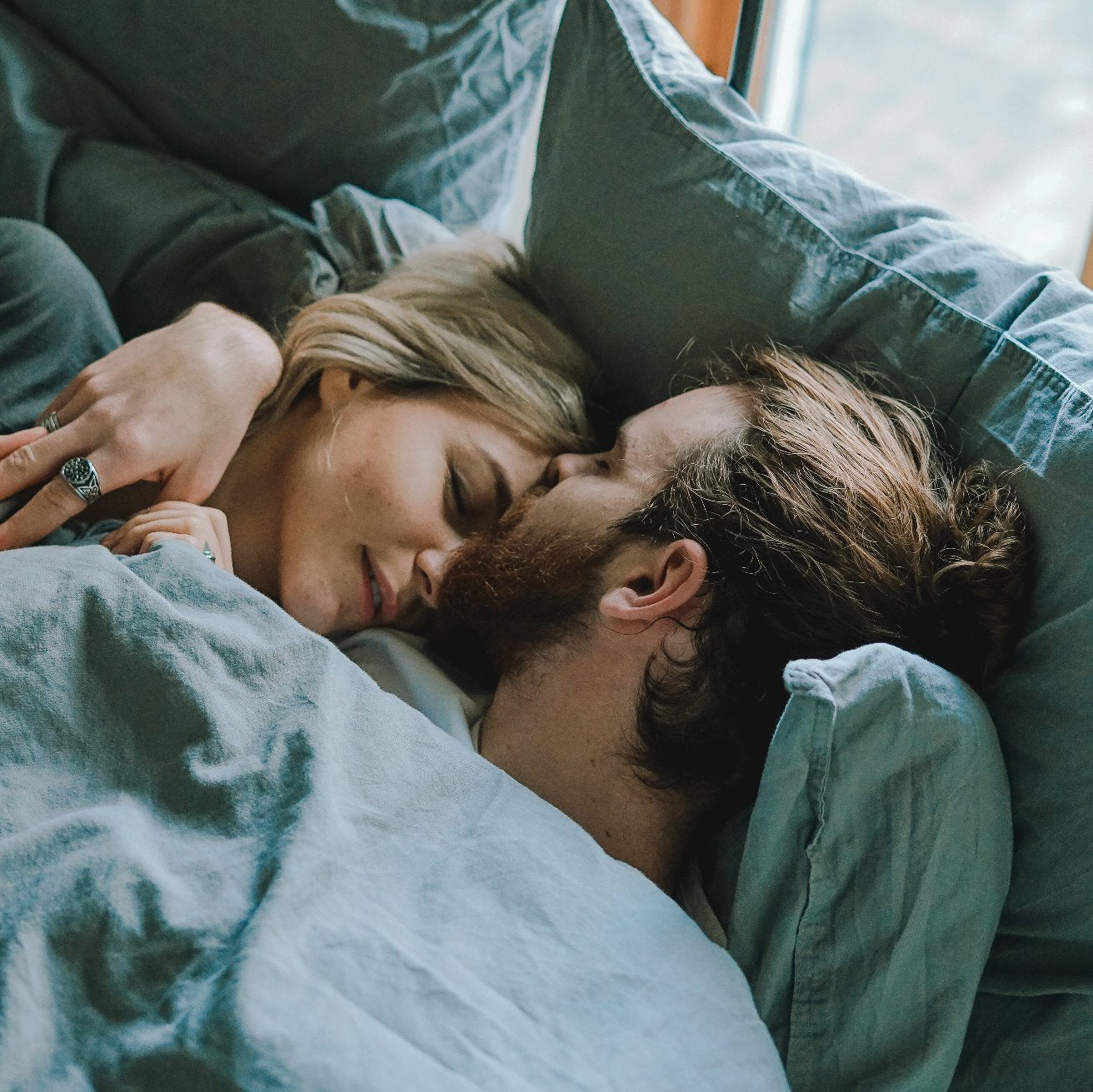 Couple in bed - intimacy after baby
