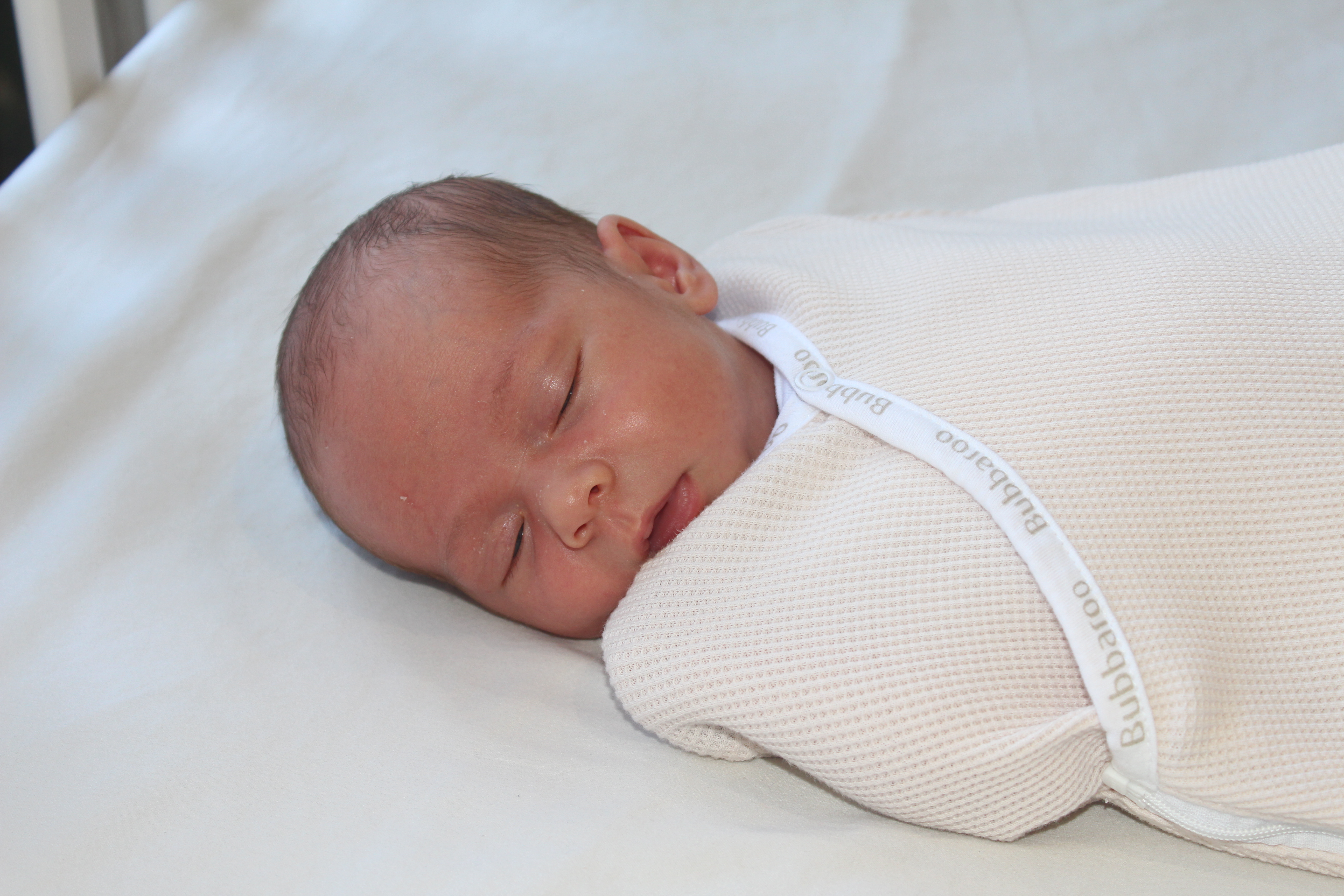 Baby swaddled in Joey Pouch Swaddle Wrap